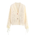 Elegante gebreide cardigan met V-hals, parels, pailletten en veters aan de mouwen - S / Melkwit