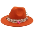 Detail of orange wool fedora with bohemian woven band, pink tassels and sea shells - Caramel color