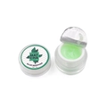 Detailed macro view of 5g matcha lash glue remover paste in a clear jar and open seal - Matcha Green