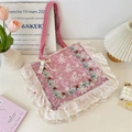Close-up of floral embroidery and delicate white lace on a pink plaid canvas bag - Red Checkerboard