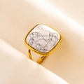 Macro shot of gold stainless steel ring with square marble stone on beige silk - Gold Base-White Marble