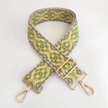 Detail of colorful ethnic jacquard wide shoulder strap with gold metal swivel hooks - Bright Yellow Green Floral