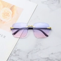 Frameless rimless sunglasses with purple pink gradient lenses and gold bridge on marble - Blue Pink Gradient