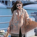 Ethnic style paisley shawl wrap in orange and blue with fringe tassels in sunny outdoor - Orange Paisley Ethnic Shawl