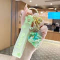 Light green conch keychain with miniature seahorse and rabbit wrist strap - Ocean Floating Sea Snail - Green
