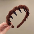 Detail of dark brown knitted acrylic headband with inner anti-slip plastic teeth - Brown
