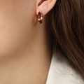 Burgundy enamel geometric hoop earrings with gold accents and zircon studs on model - Red Enamel Zirconia Inlaid