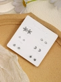 Close-up of 6 pairs minimalist stud earrings set on a weekly calendar card display - Silver Rhinestone Pearl Cross (FX885-18)