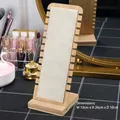 Bamboo necklace display stand with microfiber lining showing side notches on a vanity - Beige Velvet - 12 Slot Vertical Stand