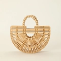 Detail of a natural bamboo handbag featuring openwork weaving and a wood bead handle - AJ-3 Beads Handle