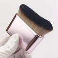 Detailed close-up of a pink flat foundation brush with dense gradient synthetic bristles - Pink Rose Gold