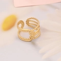 Detailed close-up of a hollow gold band ring with bead edges and a central knot design - Hollow Beaded Knot Design (9#)