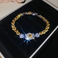 Detailed macro view of yellow zircon flower bracelet on black velvet display box - Bracelet-Yellow Flower