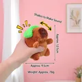 Brown capybara plush keychain with green ornament, handheld size 12.5cm, shaking sound toy - Green-eared Strange-sounding Capybara