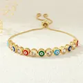 Macro view of adjustable snake chain bracelet with colorful enamel evil eye charms - Multicolor (Style A)