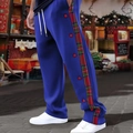 Detail view of men's casual trousers featuring red plaid panels and side snap buttons - S / Royal Blue