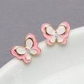 Macro shot of gold butterfly earrings with pink and white enamel and clear crystal center - Pink