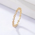 Macro shot of rose gold plated eternity ring featuring alternating geometric zircon settings - US 7 / Gold