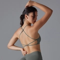 Detail view of the criss-cross back straps on an olive green high-elastic sports yoga bra - S / Dark Gray