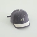 Detailed view of baby baseball cap with OK embroidery and short contrast brim - Gray