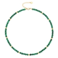 Detail of beaded necklace featuring green malachite stones and golden heart pendant - Malachite Necklace