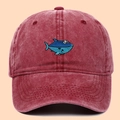 Burgundy washed cotton baseball cap with blue shark embroidery on a minimalist background - Adjustable / Burgundy