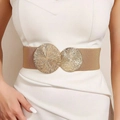 Detail of khaki elastic waist belt with textured gold-tone double ring buckle on white dress - Light Apricot