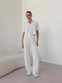 Completo due pezzi da donna in maglia bianca con polo a maniche corte e pantaloni larghi - S / Bianco