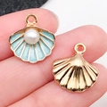 Golden shell charms with blue enamel inlay and white pearl on fingertips - Lake Blue Shell With Pearl