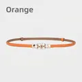 Eleganter orangefarbener schmaler Ledergürtel für Damen mit Perlen- und Strassschnalle - Orange