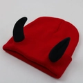 Detail view of a red knitted beanie with black devil horns and textured stitching - Adult One Size - Elastic / Black Horn - Red Hat