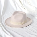 Detail of elegant wool felt fedora featuring a matching grosgrain ribbon and bow on satin - 58cm (Adult) / Cream