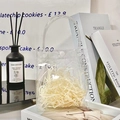 Transparent PVC gift bag with white snap button filled with beige raffia grass decoration - Gift Bag + Raffia
