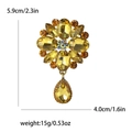 Elegant gold-tone flower brooch with yellow rhinestones and drop-shaped pendant - Yellow 1036-YL