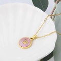 Golden stainless steel necklace with pink shell round pendant featuring letter W - Pink-W