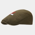 Detail of olive green canvas flat cap featuring red embroidery and vintage patch accents - One Size (56-60cm) / Olive Green