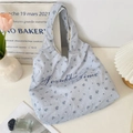 Detail of blue floral canvas tote bag featuring Sozakka Time elegant script lettering - Blue Rose
