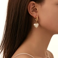 French vintage heart pearl earrings with golden twisted hoops shown on a female model - Twisted Gold Hoop Heart Pearl Earrings (E980-GO)