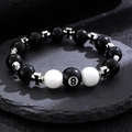 Macro detail of billiard 8 ball resin beaded keychain with silver cross spacer charms - White K 8994