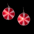 Macro shot of glowing red and white mint-shaped festive earrings on black background - Red Candy Earrings