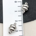 Silver magnetic jewelry clasps with lobster claws shown next to a ruler for size - Magnetic Clasp (19856)