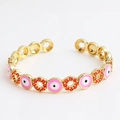 Adjustable golden bangle featuring pink evil eye drip oil and orange zircon pavé accents - Round Pink