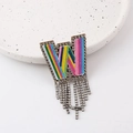 Detail of W-shaped brooch with colorful embroidery, rhinestones and elegant long tassels - Letter W