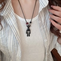 Artistic black bear pendant necklace with red bead accents on a casual long cord - Black Artistic Figurine Necklace