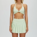 Two-piece light green yoga set featuring a halter twist sports bra and pleated mini skirt - L / Top And Bottom / Bra + Skirt - Light Fruit Green