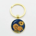 Golden Van Gogh Sunflowers keychain with round glass pendant on a white background - Gold-Sunflowers Blue Background