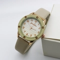 Detail showing wavy texture dial with rose gold numerals on a fashion quartz watch - Yellow