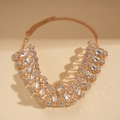 Macro detail of geometric hollow necklace with rose gold finish and sparkling rhinestones - Gold