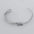 Bracelet jonc à nœud en acier inoxydable argenté avec design ouvert et poli - Nœud Asymétrique Argenté (A1106)