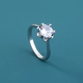 Detail of silver ring featuring flower-shaped six-prong setting with round clear zircon - Adjustable Open / Clear Round Gemstone/Six-Prong Flower